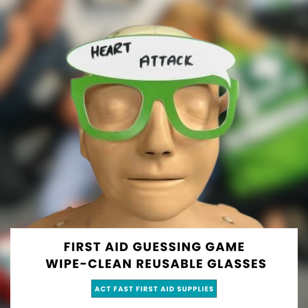 Training manikin wearing green First Aid Guessing Game glasses with "Heart Attack" written on the lens, from Act Fast First Aid Supplies